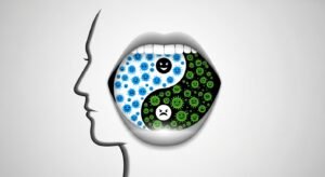 A diagram showing a human head with a yin-yang symbol in the mouth, representing the balance of good and bad oral bacteria.